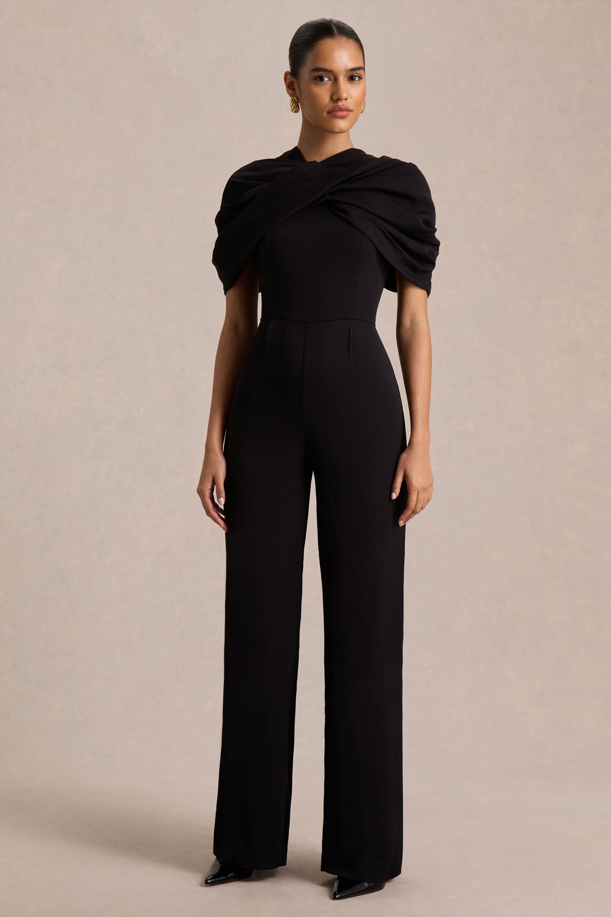 Raquel | Black Asymmetric-Neck Jumpsuit With Twisted Cape Detail