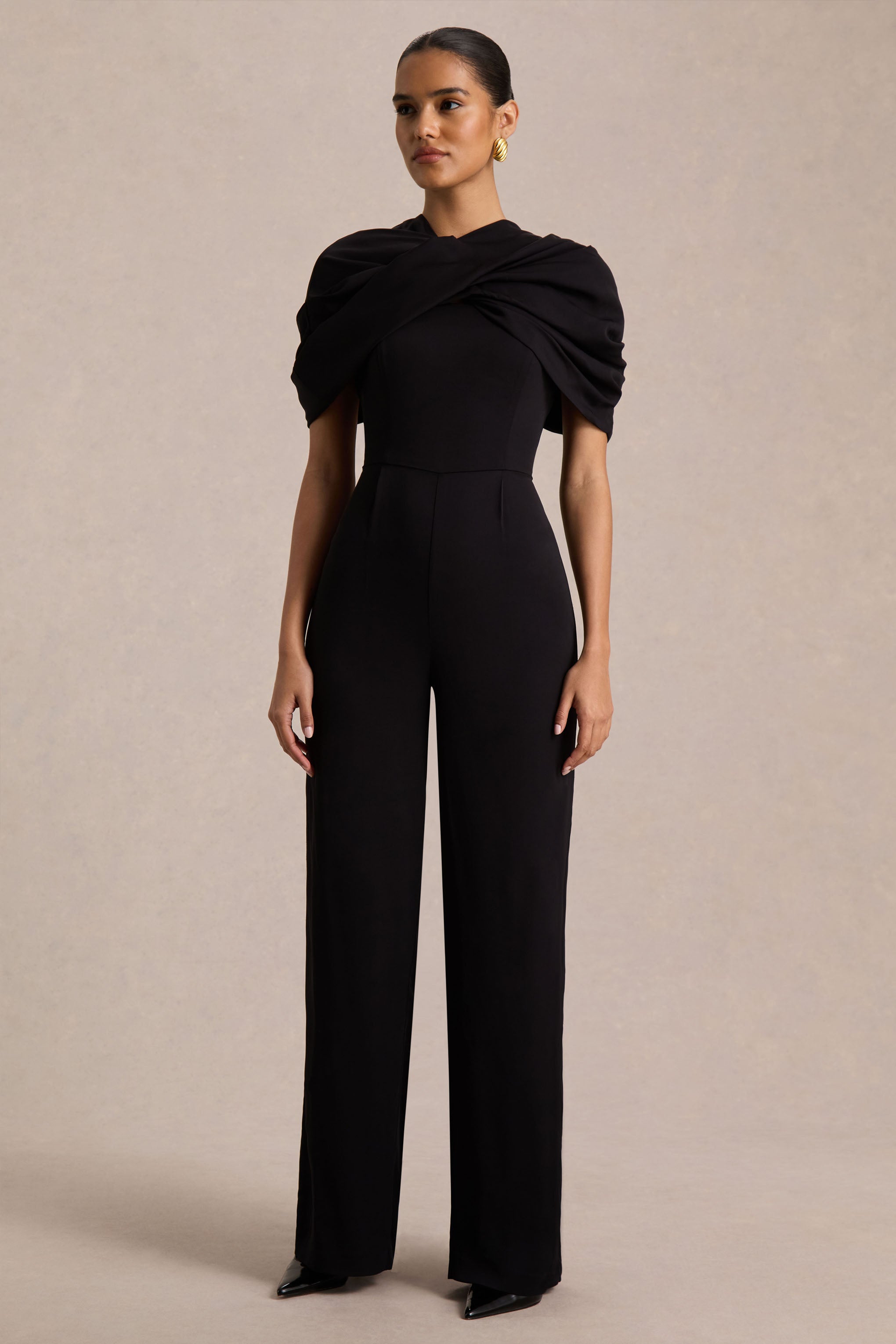 Raquel | Black Asymmetric-Neck Jumpsuit With Twisted Cape Detail