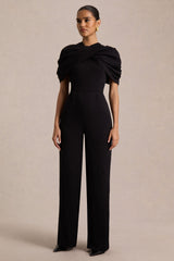 Raquel | Black Asymmetric-Neck Jumpsuit With Twisted Cape Detail