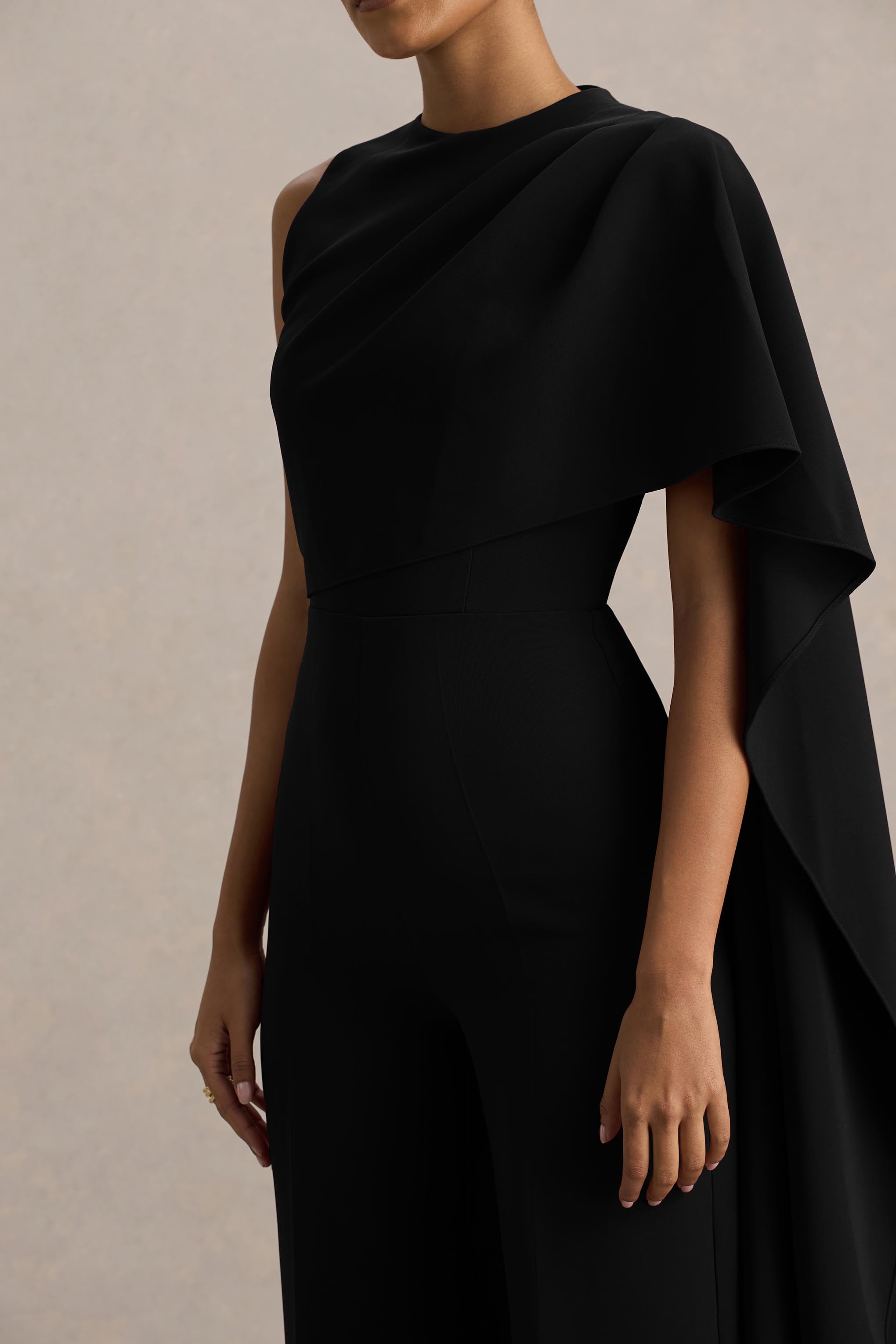 Sorenia | Black High-Neck Jumpsuit With One-Cape Sleeve