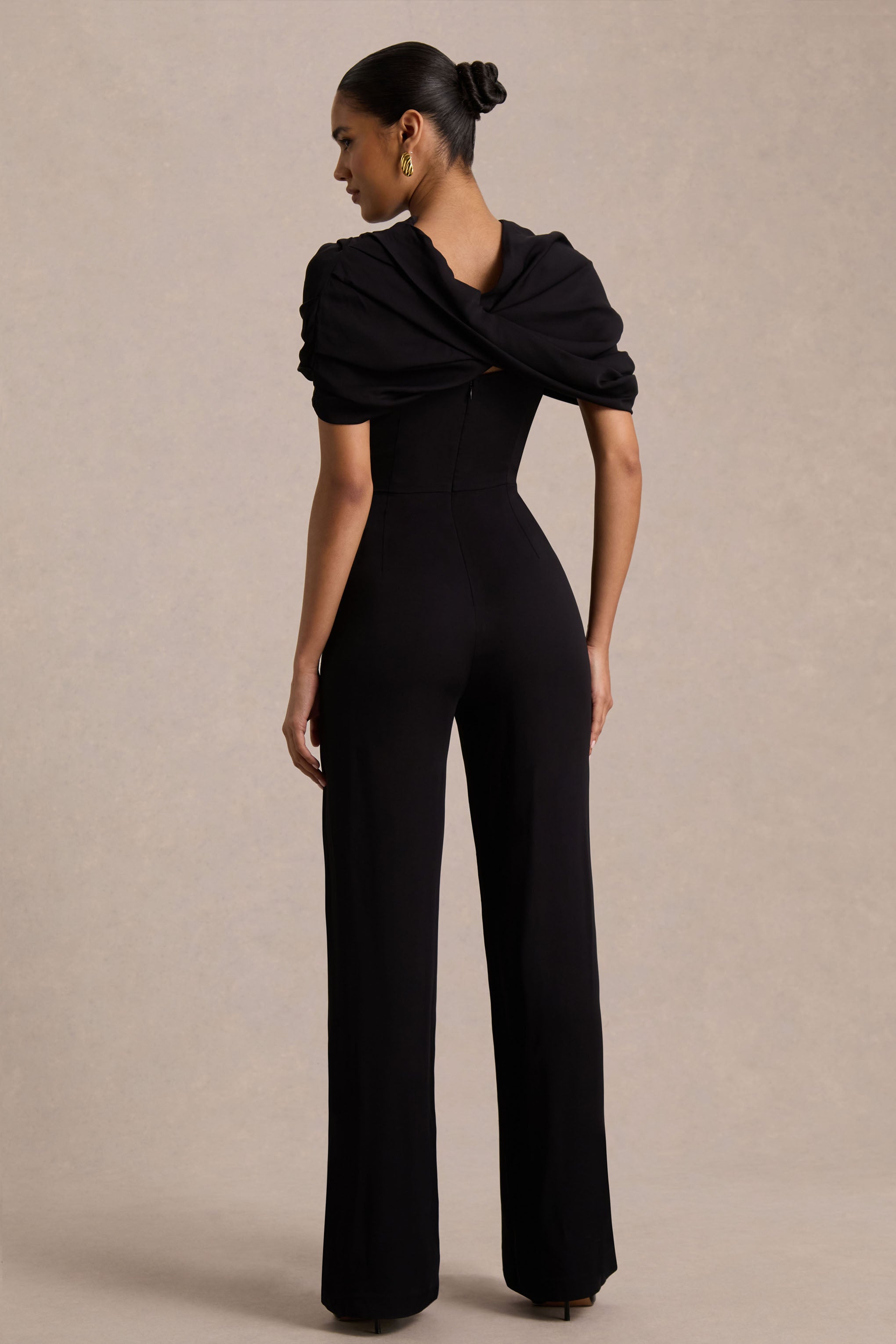 Raquel | Black Asymmetric-Neck Jumpsuit With Twisted Cape Detail
